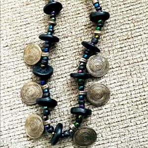 A multi color beads and silver charms necklace